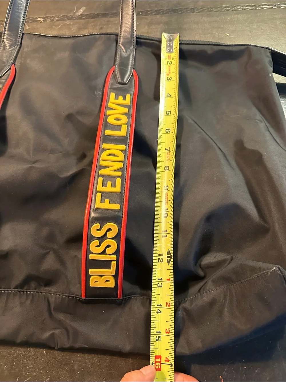 Fendi Black Duffel Bag with Yellow and Red Logo Straps